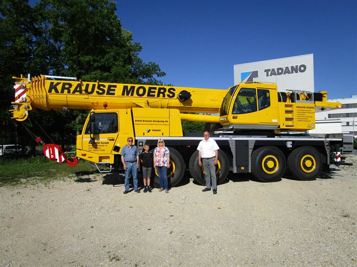 The Krause family with Tadano area sales manager Manfred DrÃ¶ÃŸer, right, in front of the new Tadano ATF 100G-4. From left to right: Hans-Georg Krause, grandson Florian GÃ¼llich, and Jutta Krause
